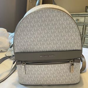 Never used. Micheal Kors backpack